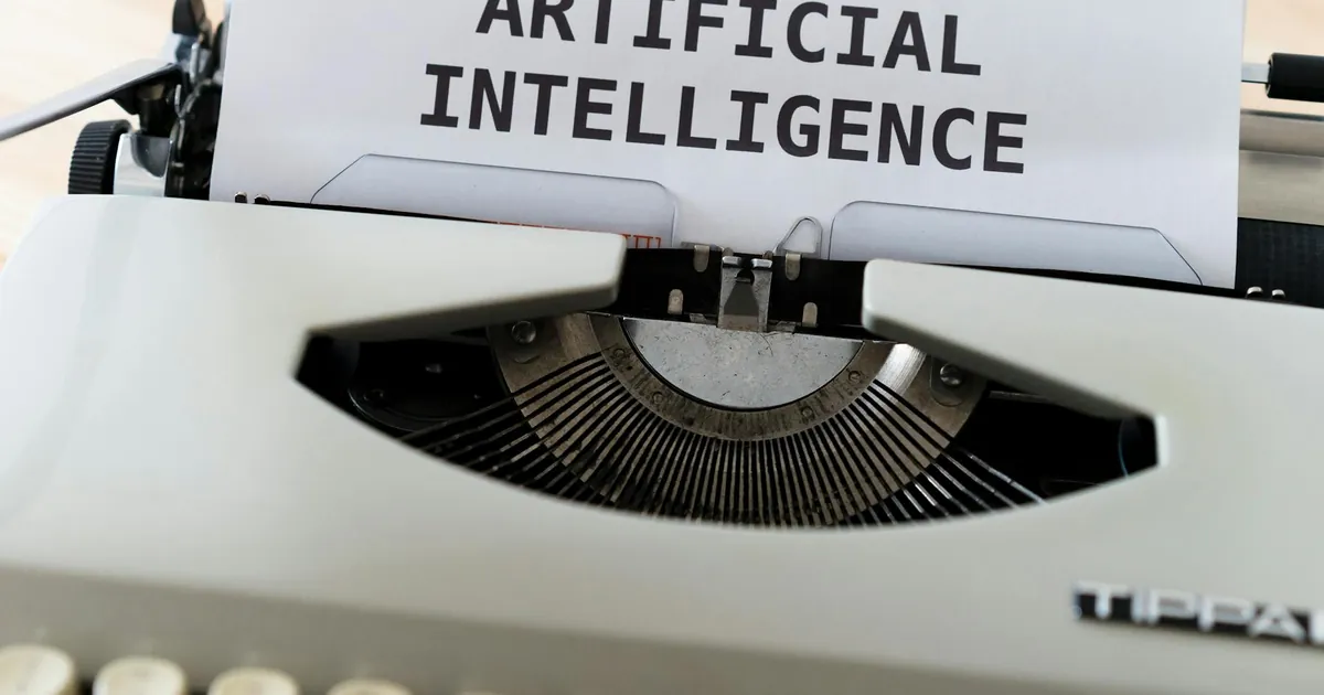 A close-up of a typewriter showcasing 'ARTIFICIAL INTELLIGENCE' on paper.